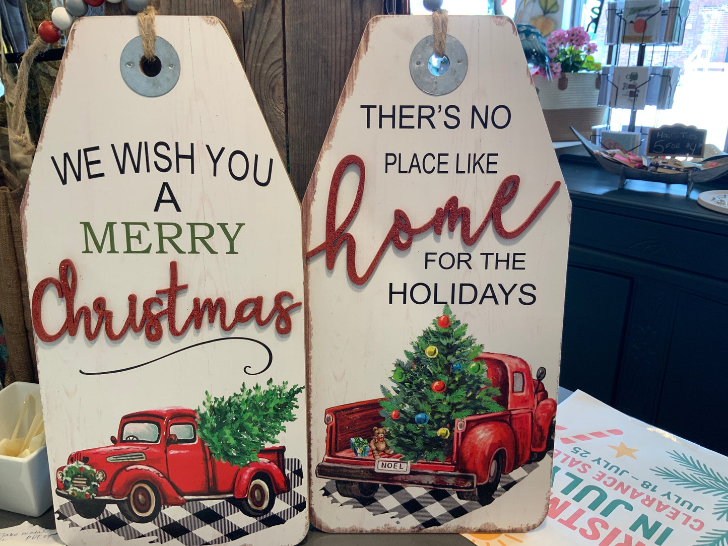 Truck sign with “we wish you a Merry… & there’s no place like home…